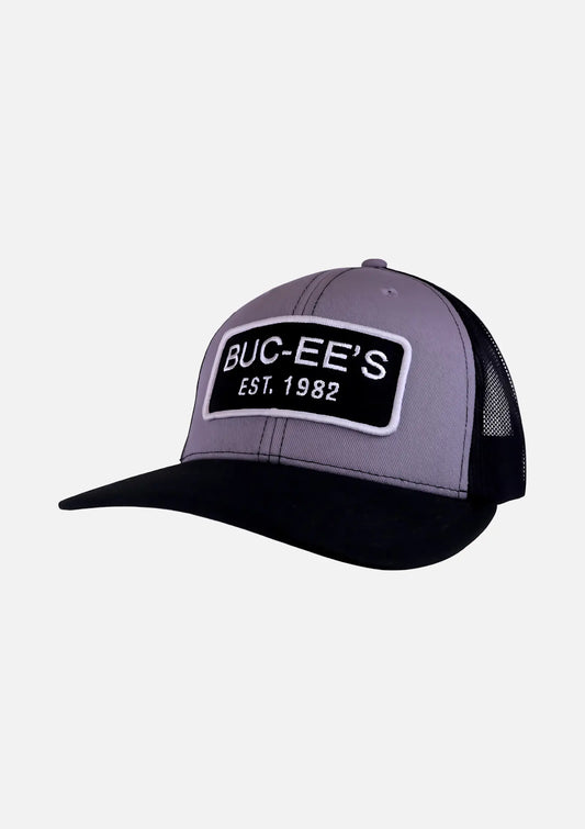 Buc-ee's Gray and Black Snapback Trucker Hat with embroidered text "Buc-ee's EST. 1982"